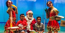 De bermuda de praia, Papai Noel recebe a criançada no MULTI Open Shopping em Florianópolis